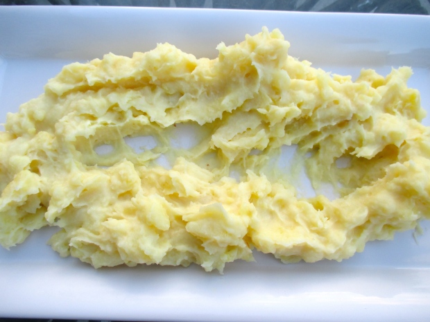 plate mashed potatoes, make indention in the center