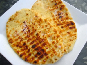 meanwhile, cook naan, brush with ghee, sprinkle with kosher salt
